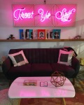 neon treat yourself sign